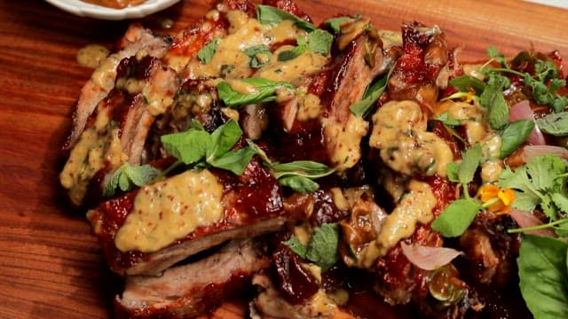 Pork ribs with green herbs and mustard sauce