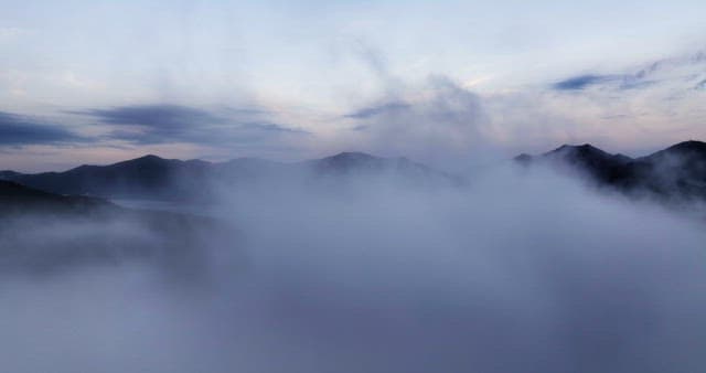 Mountains shrouded in early morning mist