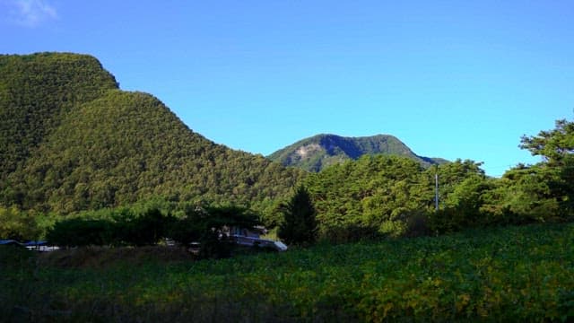 Serene mountain landscape with a clear blue sky