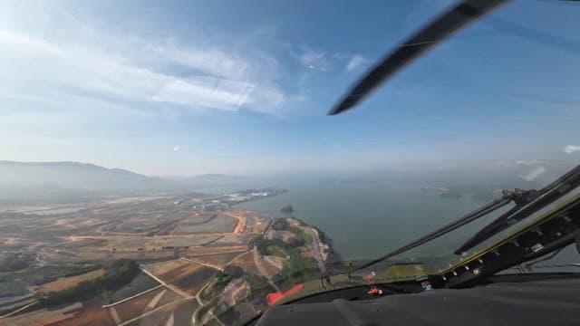 Coast from a helicopter cockpit on a clear day
