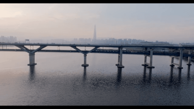 Bridge over river with subway and cars