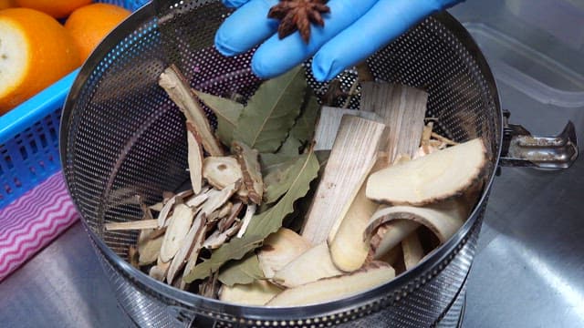 Preparing Herbal Ingredients in Kitchen