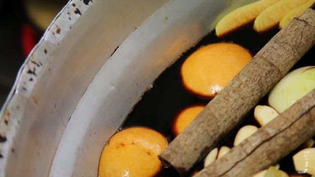 Medicinal herbs, green onions, pears, garlic, and onions in a pot to make the seasoning sauce