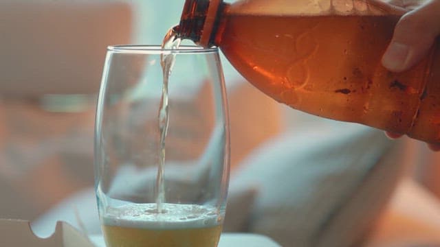 Pouring beverage into a glass