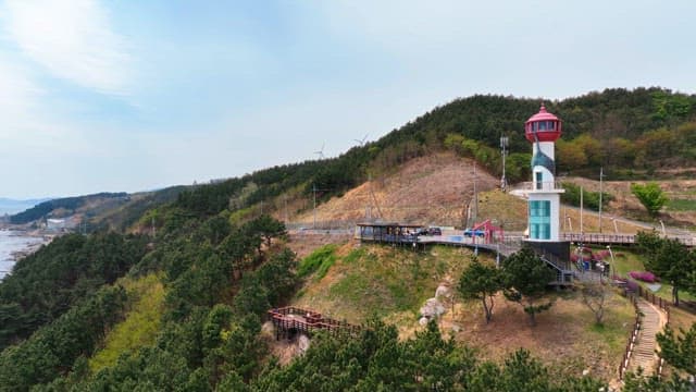 Lighthouse on a scenic coastal hill