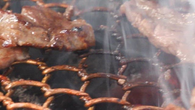 Sizzling beef on a grill