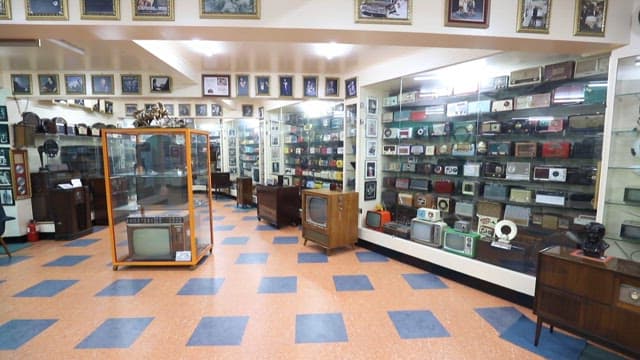 Museum exhibit of historic radios and televisions