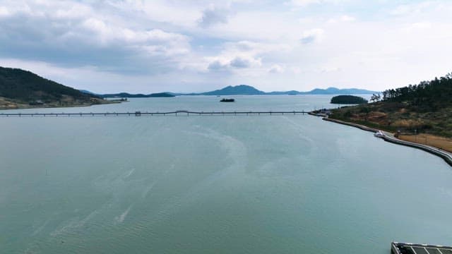 Vast sea with distant mountains