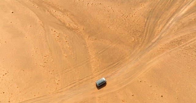 Vehicle traveling across a desert