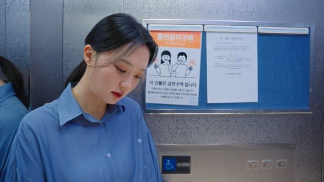 Woman getting off the elevator