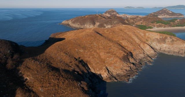 Serene Coastal Landscape with Hills and Sea