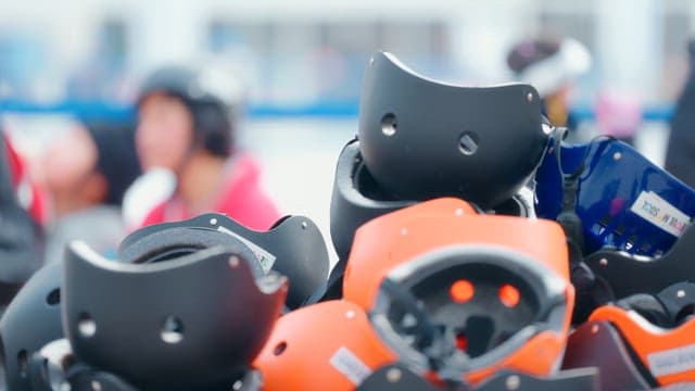 Stack of skate helmets