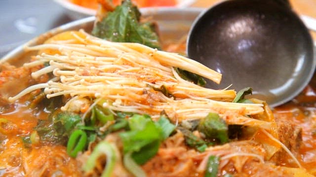 Spicy pork backbone stew boiling in a pot