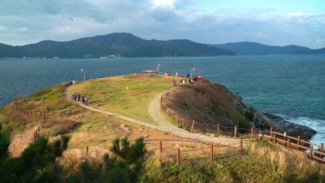People walking on a scenic coastal path