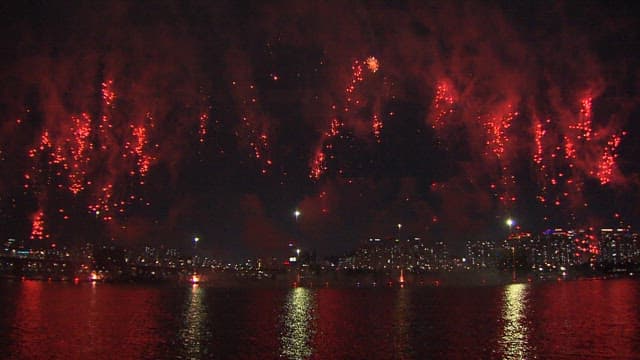 Dazzling fireworks display over the cityscape at night