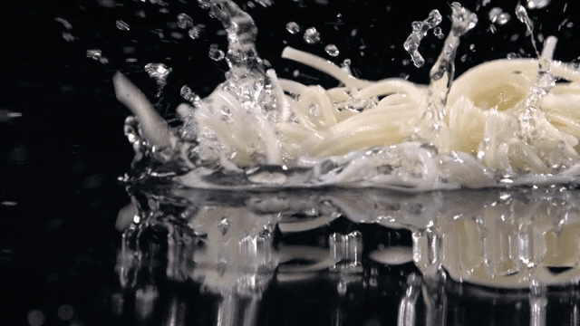 Noodles splashing in water