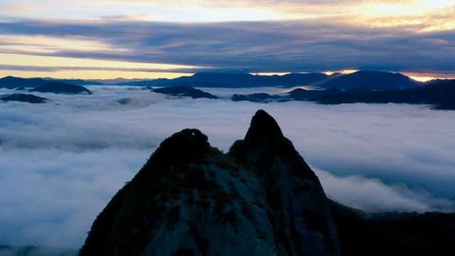 Majestic Mountains Rising Above Clouds