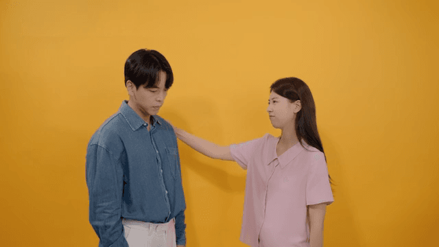 Woman comforting a man with a worried expression