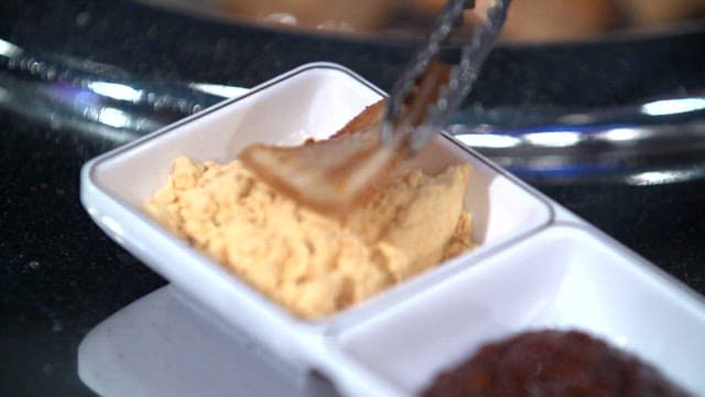 Pork rinds dipped in bean flour