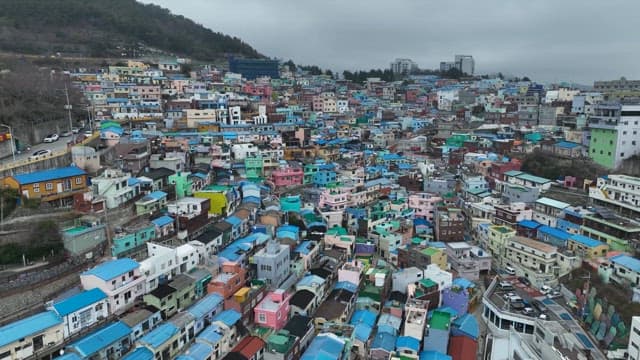 Colorful hillside village with vibrant rooftops