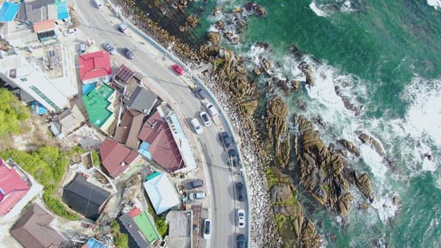 Coastal road with colorful rooftops