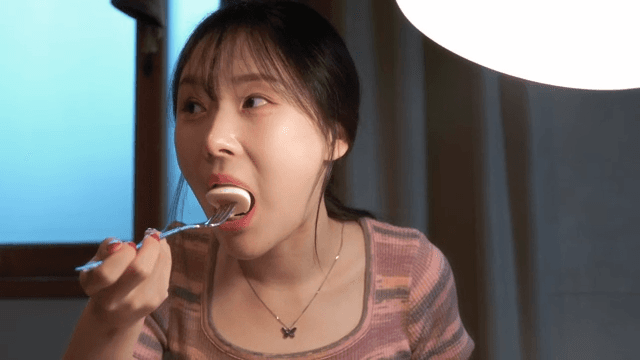 Woman enjoying a meal indoors