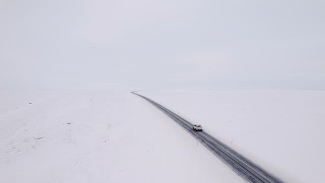 Car driving on a snowy road