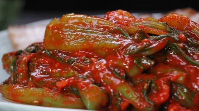 Plate of Korean boiled pork with bok choy kimchi
