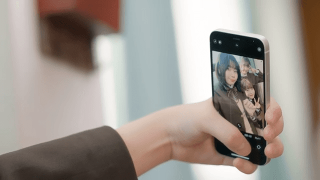 Students taking selfies in school