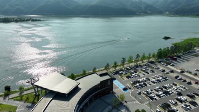 Boating on Scenic Lakeside with Mountains