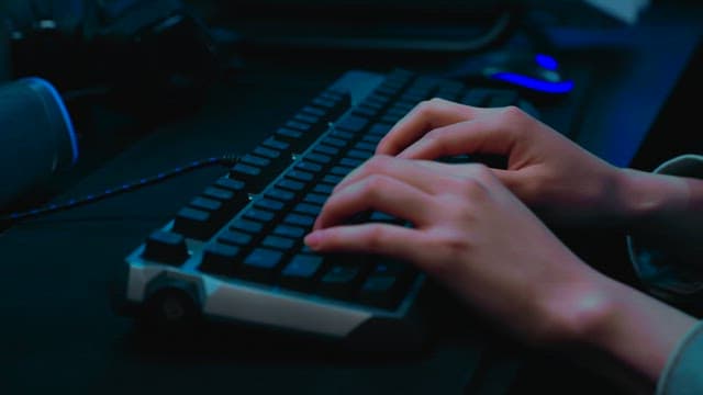 Person Typing on a Mechanical Keyboard