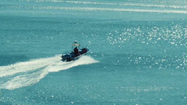 Speedboat Gliding Across Sparkling Waters