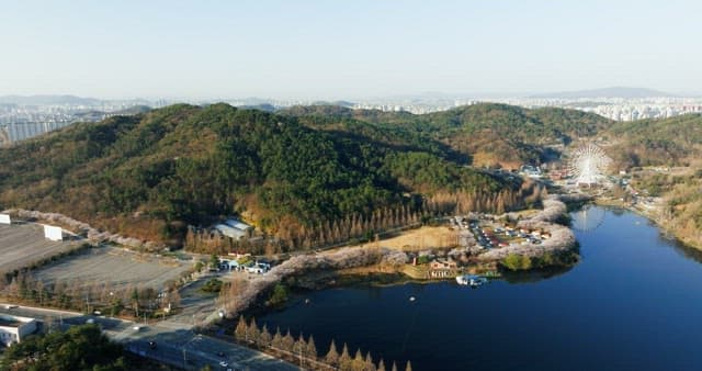 Hilly landscape with ferris wheel