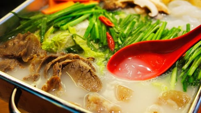 Boiling tendon hotpot with vegetables and meat in a pot