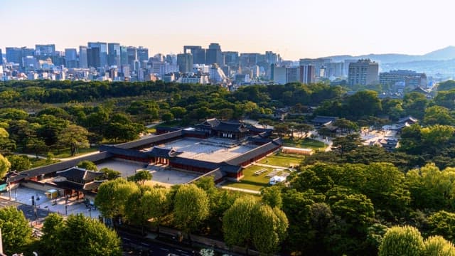 Traditional palace surrounded by modern cityscape