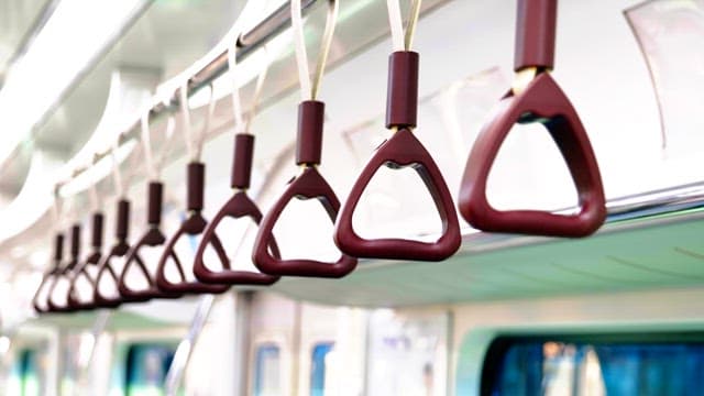 Passenger handrails on an empty subway