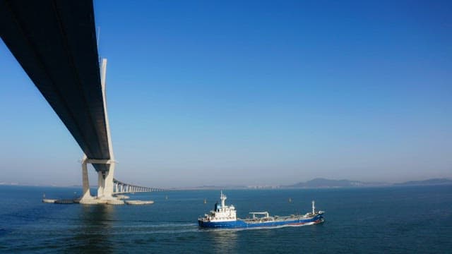 Ship passing under a Incheon bridge