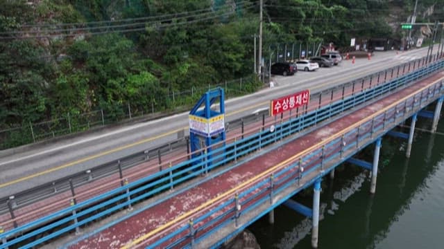 Serene Lake with a View of the Water Control Line and Road