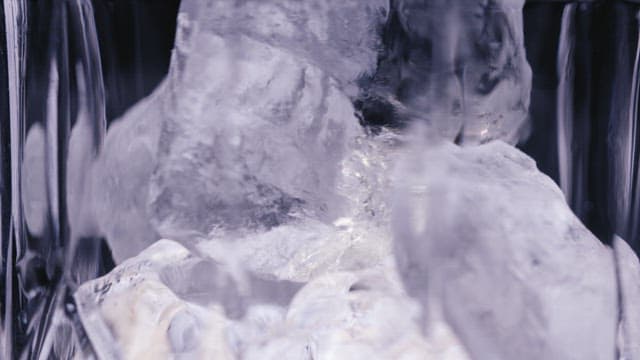 Whiskey Poured over Ice in a Glass