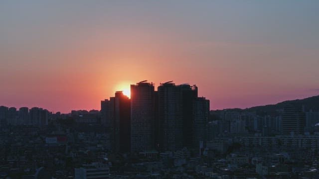 Sunset over a city skyline