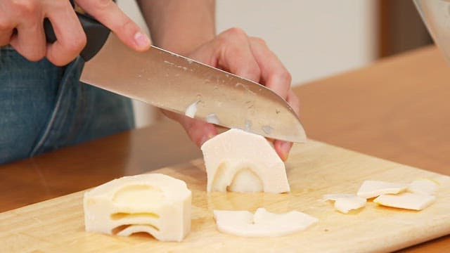 Slicing bamboo shoots on a cutting board
