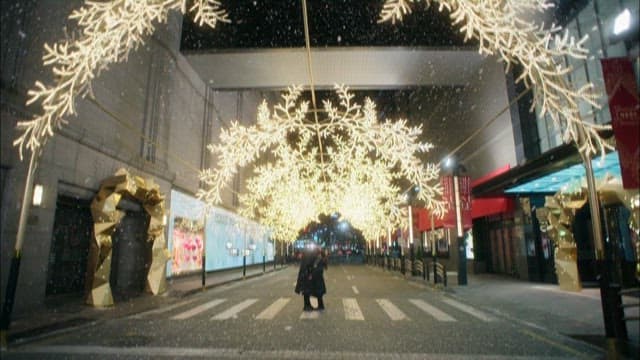 Snowy Night with Illuminated Street Decorations