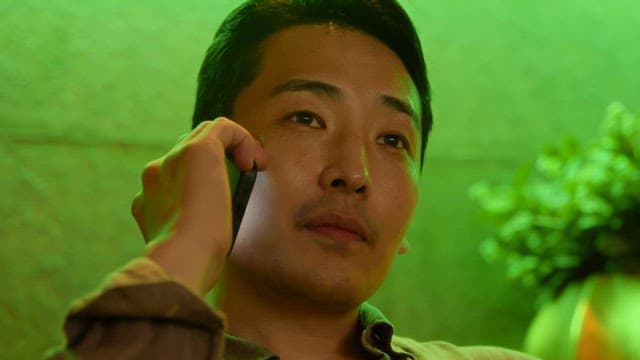 Man talking on the phone indoors