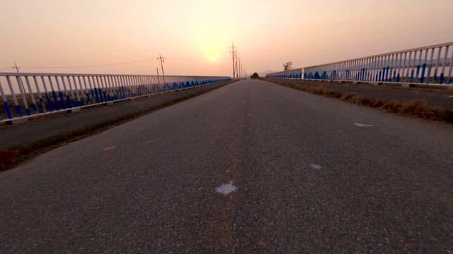 Empty Roadway and Wetlands at Dusk