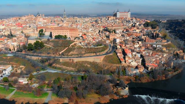 Toledo with a river and buildings