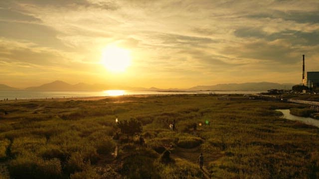 Sunset over a coastal landscape