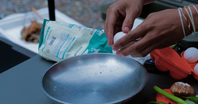 Breaking Eggs in a Bowl for Cooking