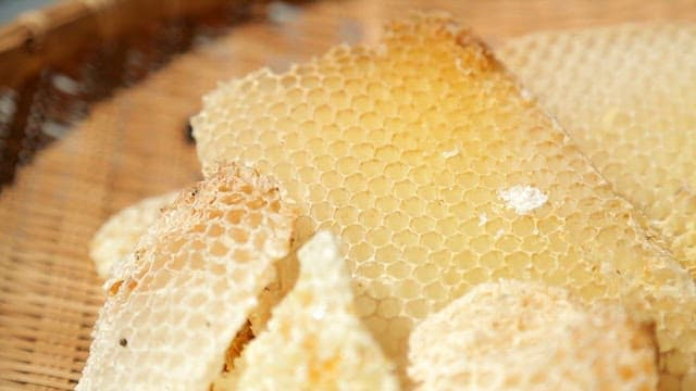 Fresh honeycomb on a wicker tray