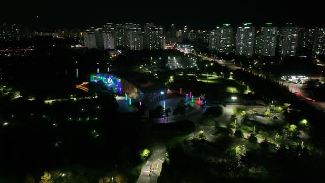 Colorful Night View of Urban Park and Buildings