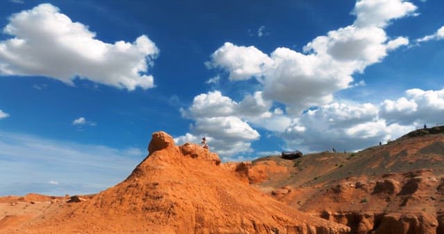 Vast desert landscape under a blue sky